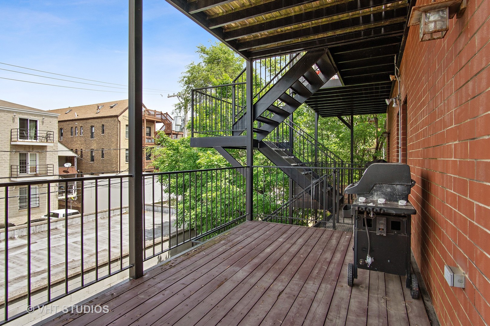 1502 West Augusta Boulevard, Unit 3W Chicago, IL 60642 - Photo 23 of 23 a view of a balcony with wooden floor