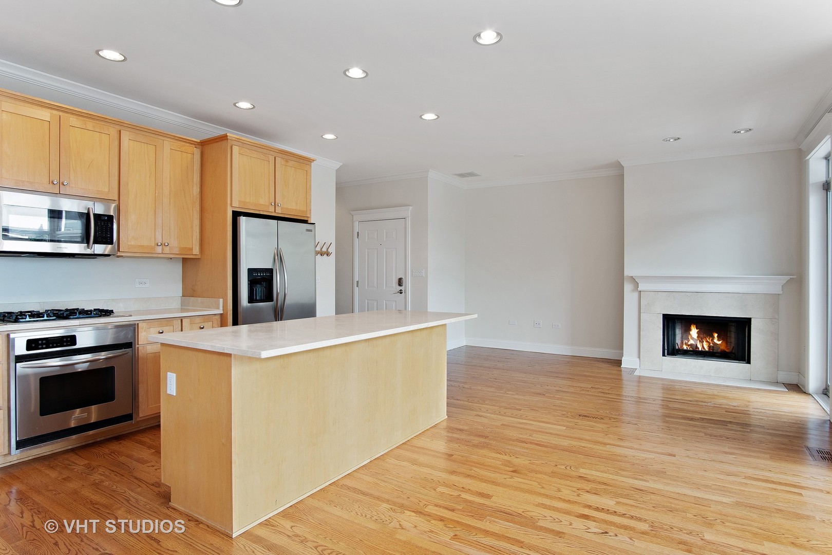 1502 West Augusta Boulevard, Unit 3W Chicago, IL 60642 - Photo 8 of 23 a view of kitchen view wooden floor stainless steel appliances and cabinets