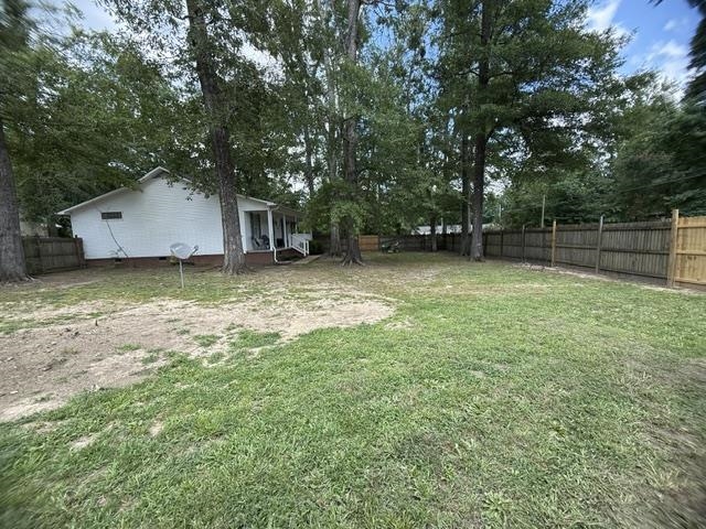 395 Austin Street Savannah, TN 38372 - Photo 31 of 32 Spacious backyard featuring a mix of mature trees and open lawn space