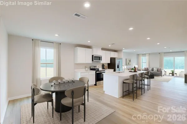 a view of a dining room with furniture