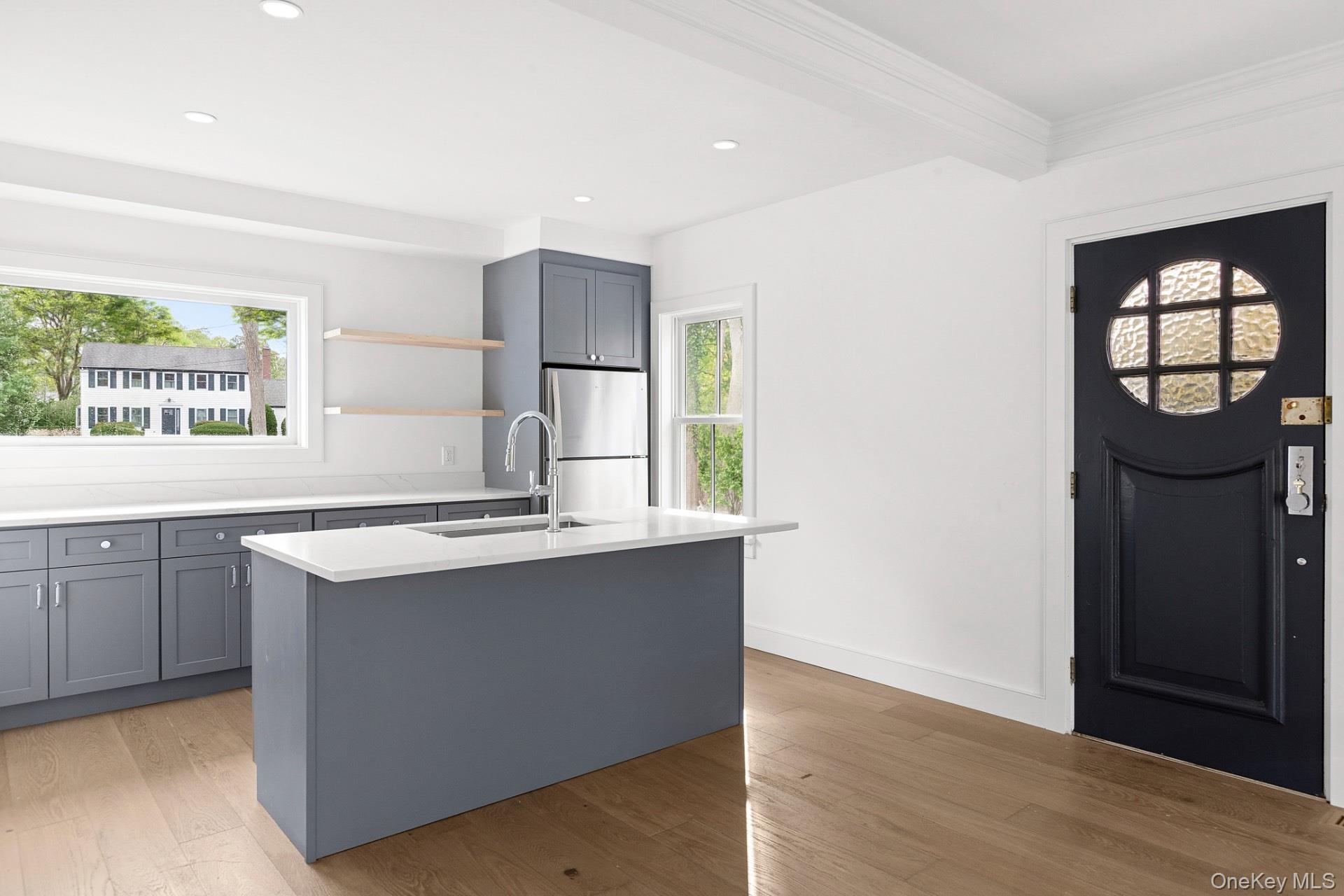 5 Pheasant Lane Remsenburg, NY 11960 - Photo 14 of 27 Kitchen with gray cabinetry, freestanding refrigerator, light wood-style flooring, recessed lighting, and open shelves