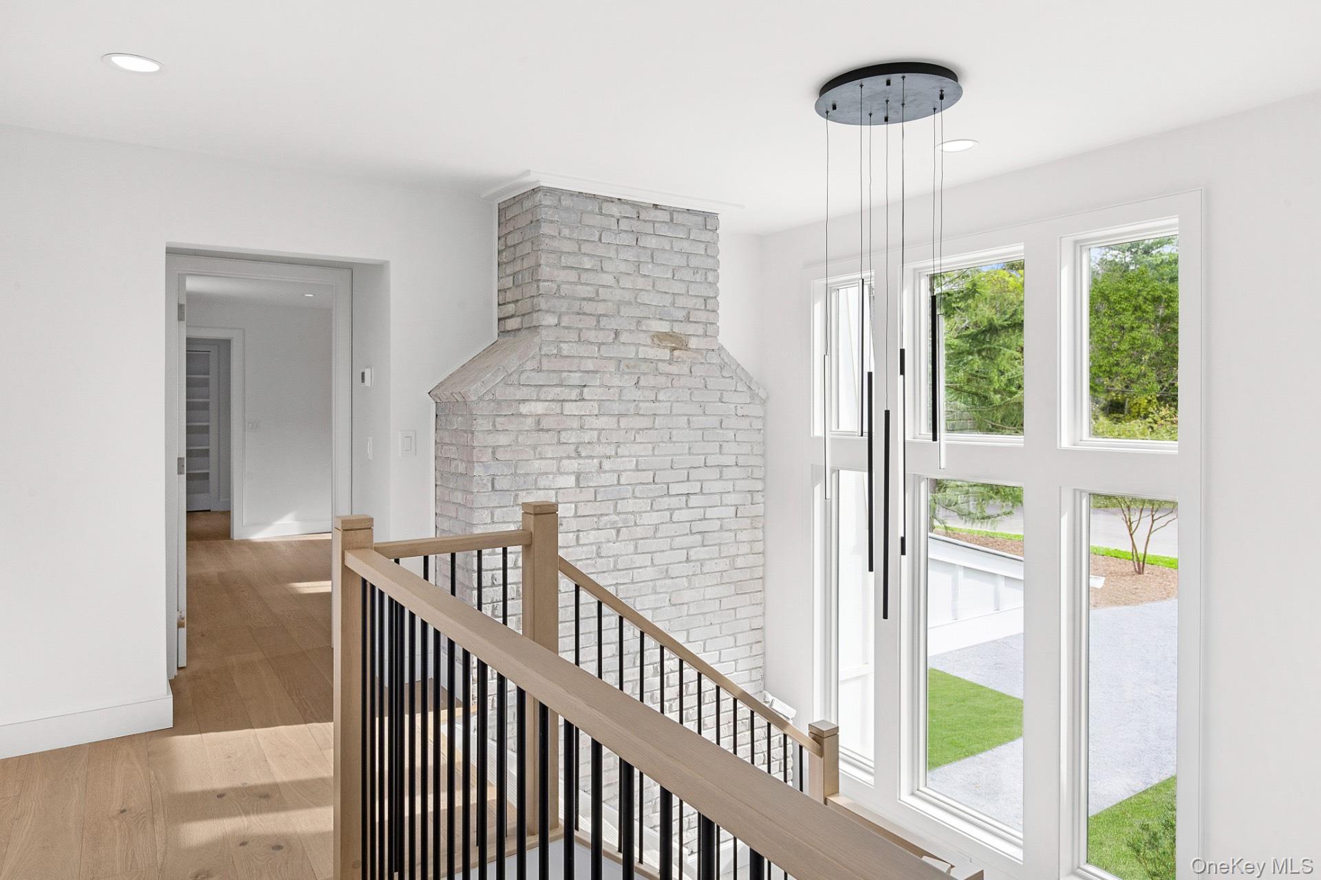 5 Pheasant Lane Remsenburg, NY 11960 - Photo 16 of 27 Corridor with light wood-style flooring, an upstairs landing, and recessed lighting