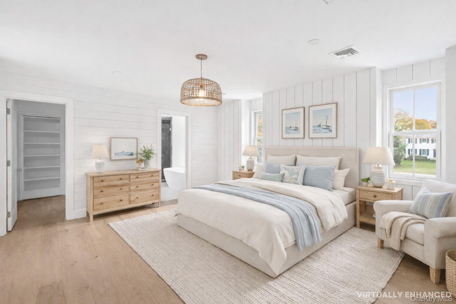 5 Pheasant Lane Remsenburg, NY 11960 - Photo 19 of 32 a bedroom with a bed and wooden floor