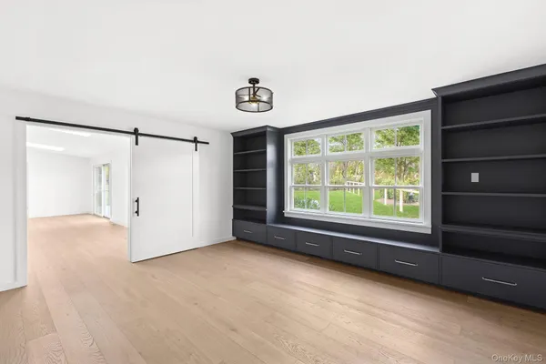 a view of an empty room with a window