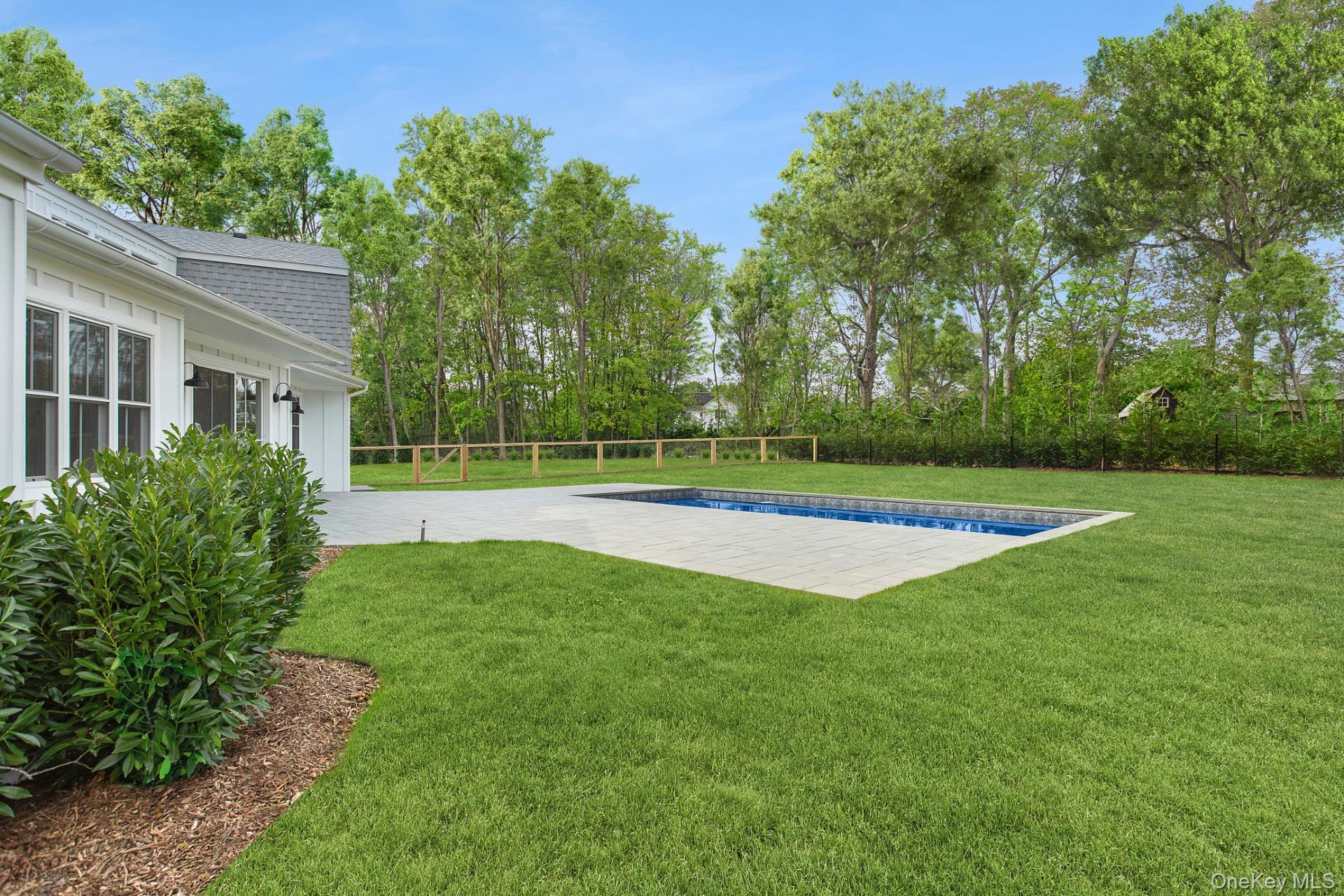 5 Pheasant Lane Remsenburg, NY 11960 - Photo 26 of 27 View of yard featuring a patio area and view of wooded area