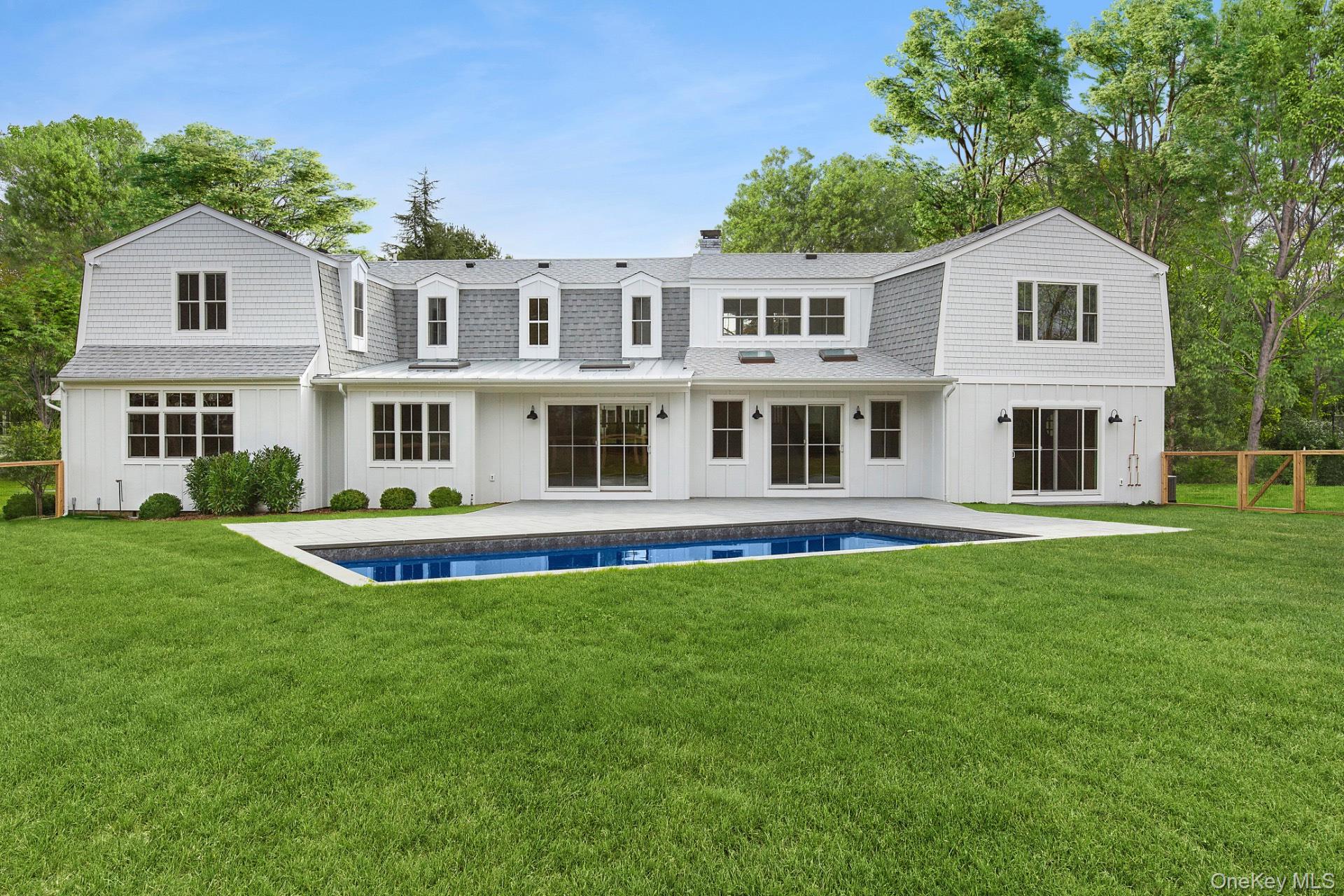 5 Pheasant Lane Remsenburg, NY 11960 - Photo 31 of 32 a front view of a house with a yard