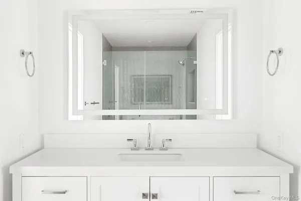 a bathroom with a bathtub and a sink