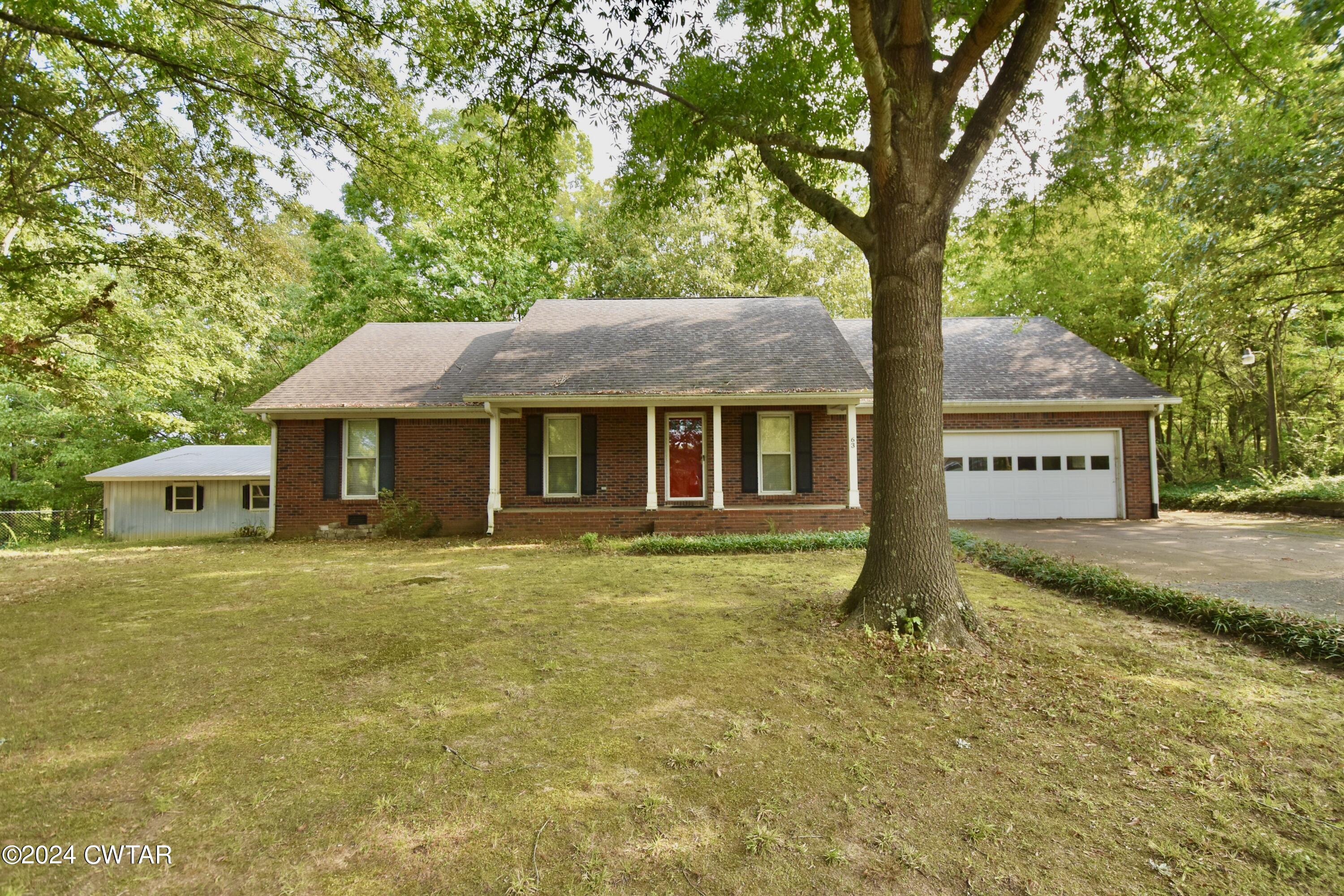 63 Deep Gap Road Jackson, TN 38301 - Photo 1 of 31 a house with swimming pool in front of it