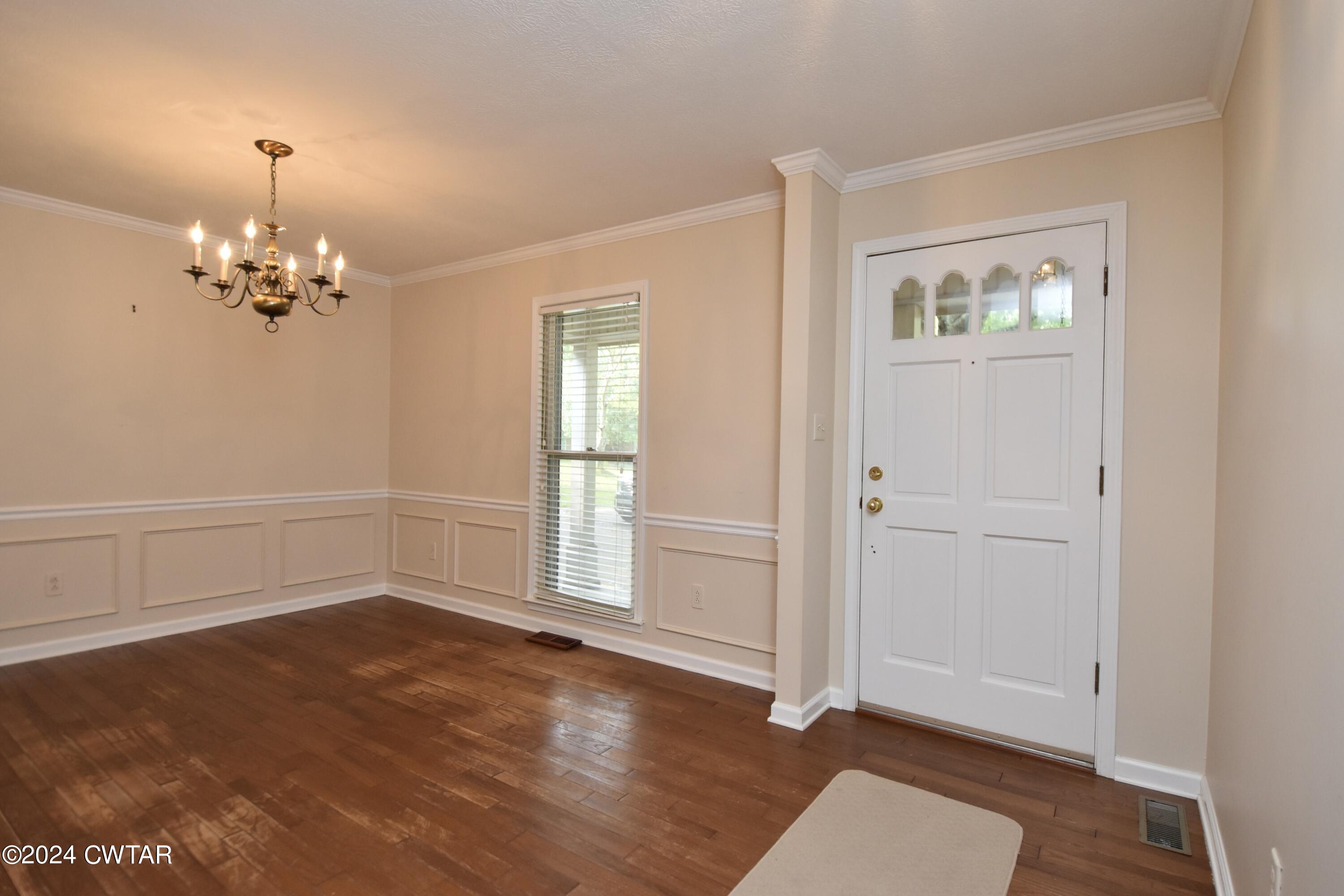 63 Deep Gap Road Jackson, TN 38301 - Photo 3 of 31 wooden floor in an empty room with a window