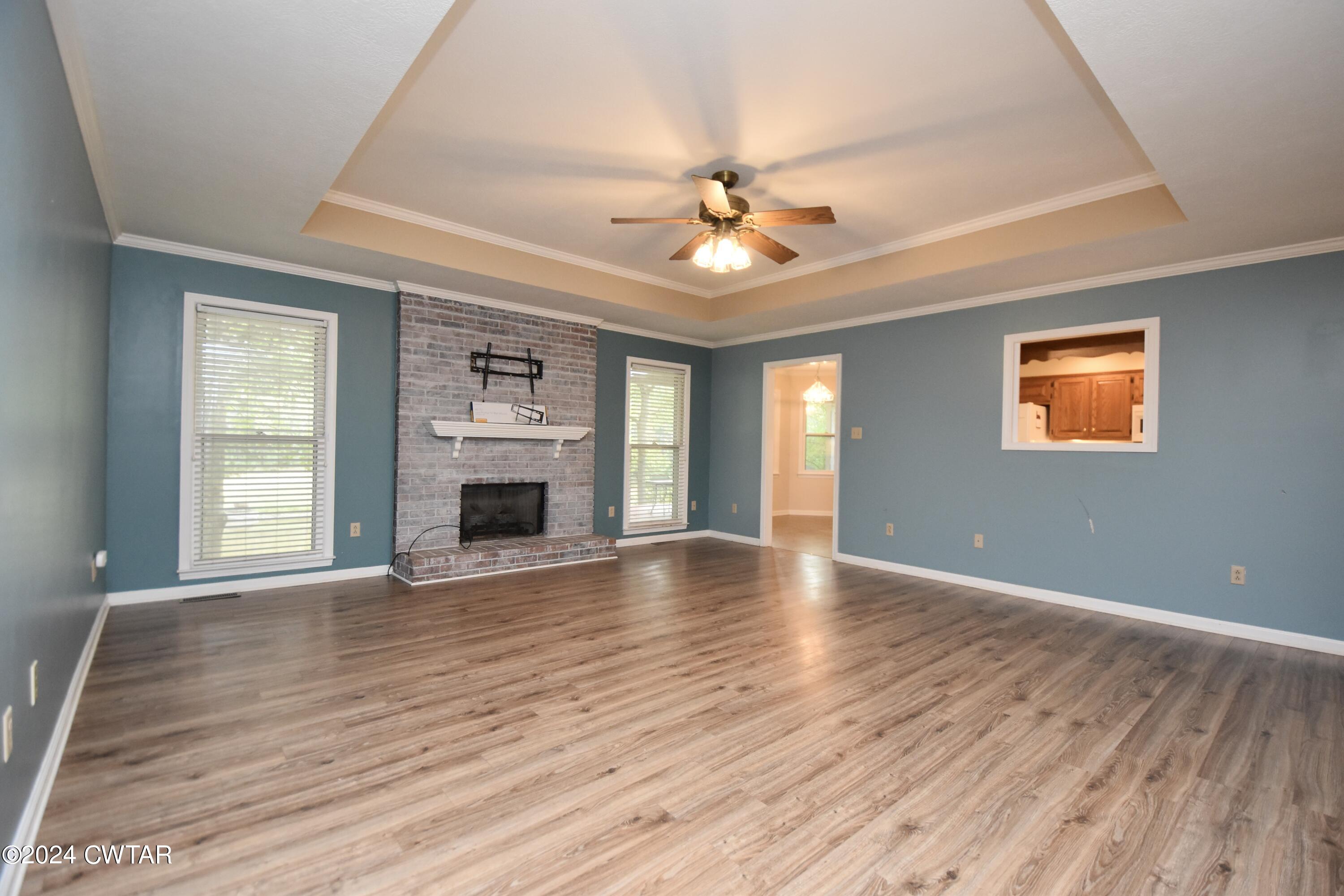 63 Deep Gap Road Jackson, TN 38301 - Photo 5 of 31 a view of an empty room with a fireplace and a window