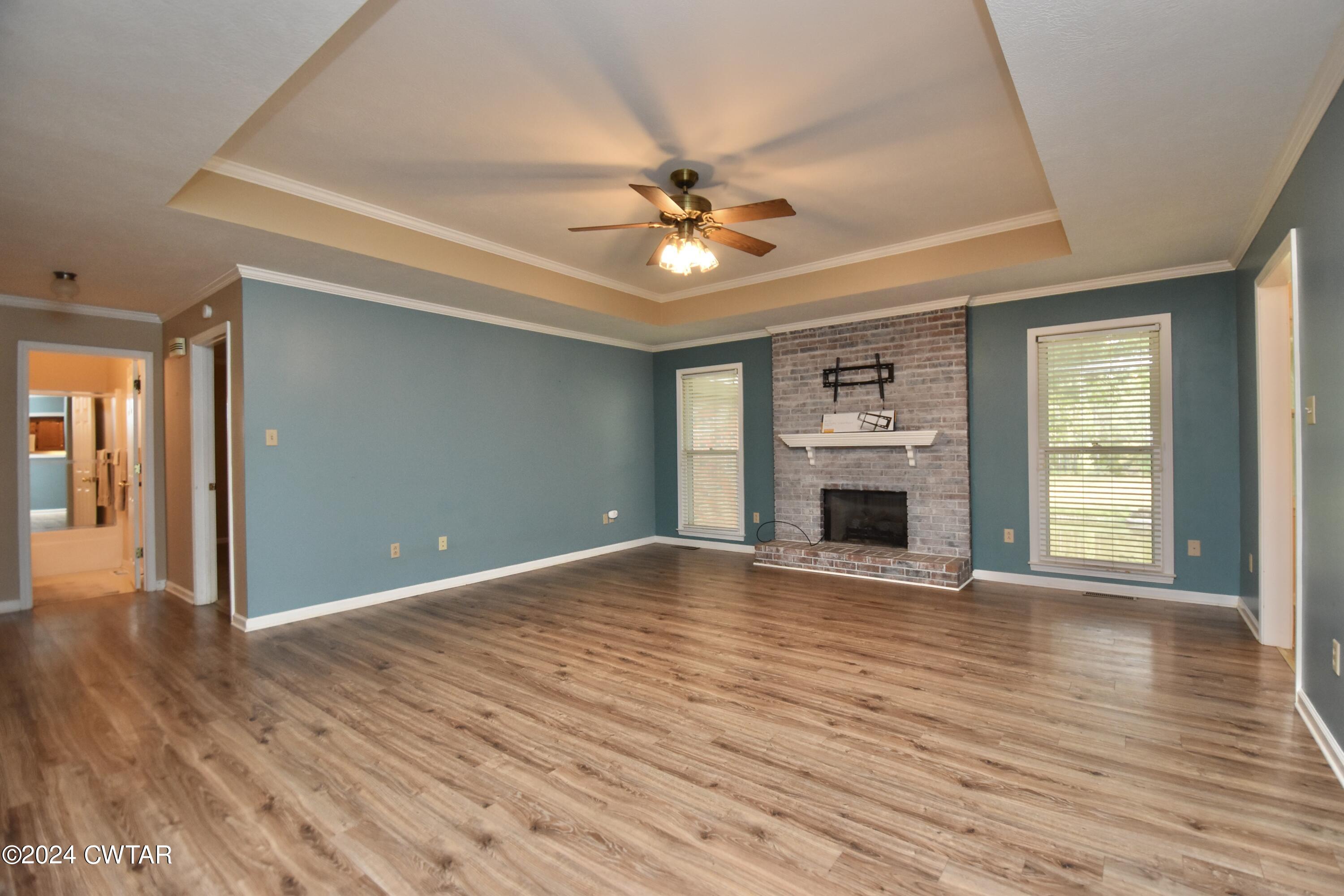 63 Deep Gap Road Jackson, TN 38301 - Photo 6 of 31 a view of empty room with wooden floor and fireplace