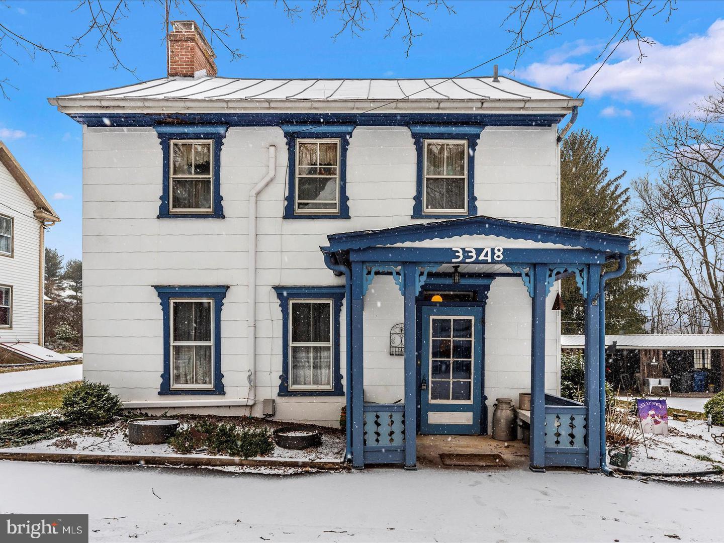 a front view of a house with barbeque area