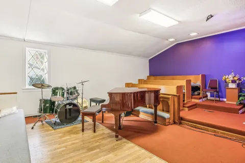 a living room with furniture and flat screen tv