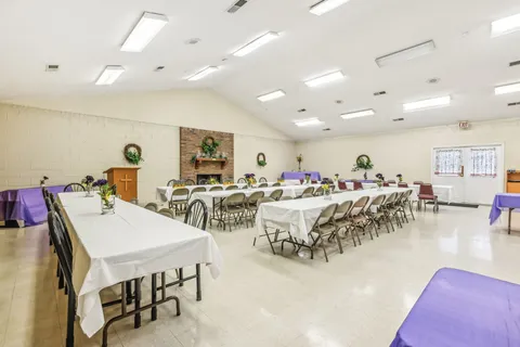 a view of a dining area with furniture and a table