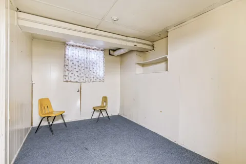 a room with furniture and air hockey table
