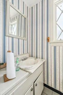 a front view of house with yard and trees