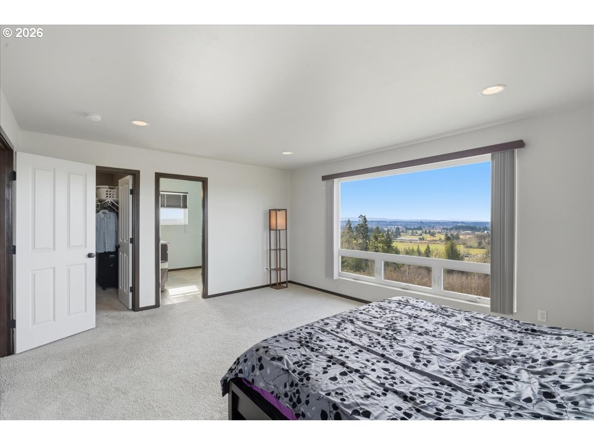 163 Yates Road Chehalis, WA 98532 - Photo 15 of 33 a bedroom with a bed and a large window