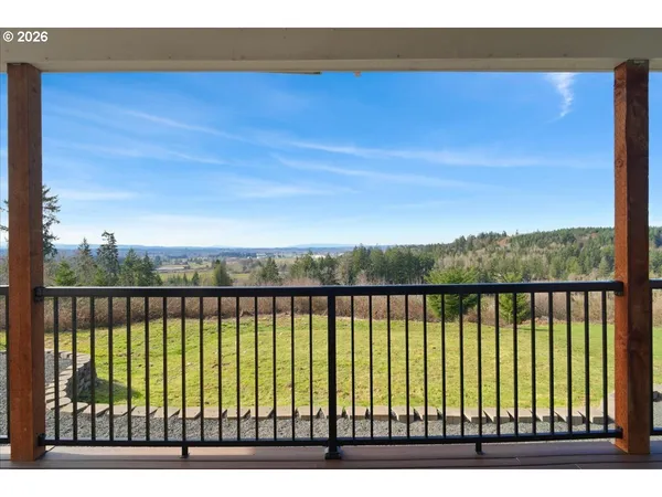 a view of balcony with wooden floor