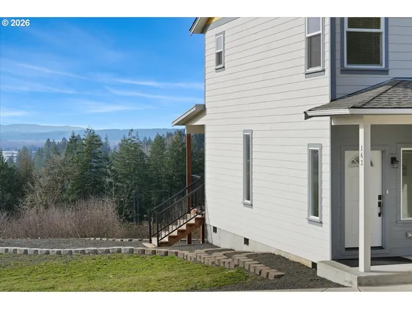 a view of a house with a yard