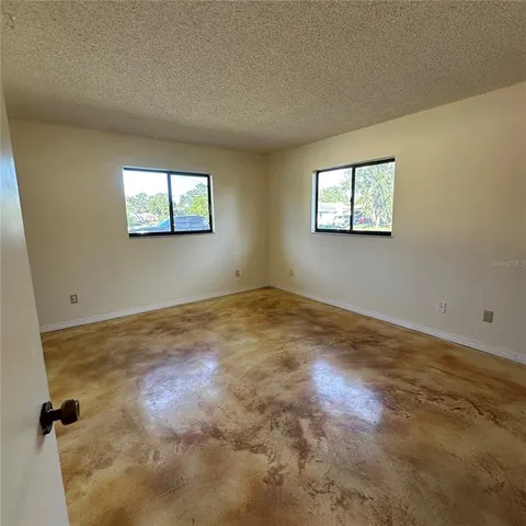 an empty room with closet area
