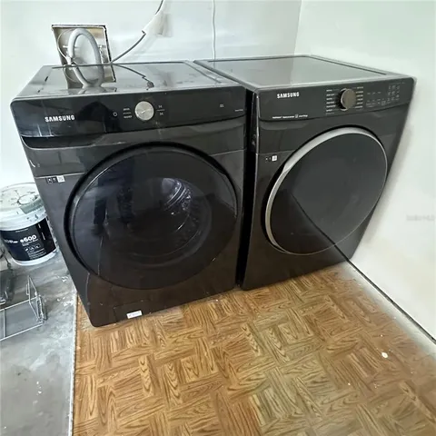 a utility room with dryer and washer