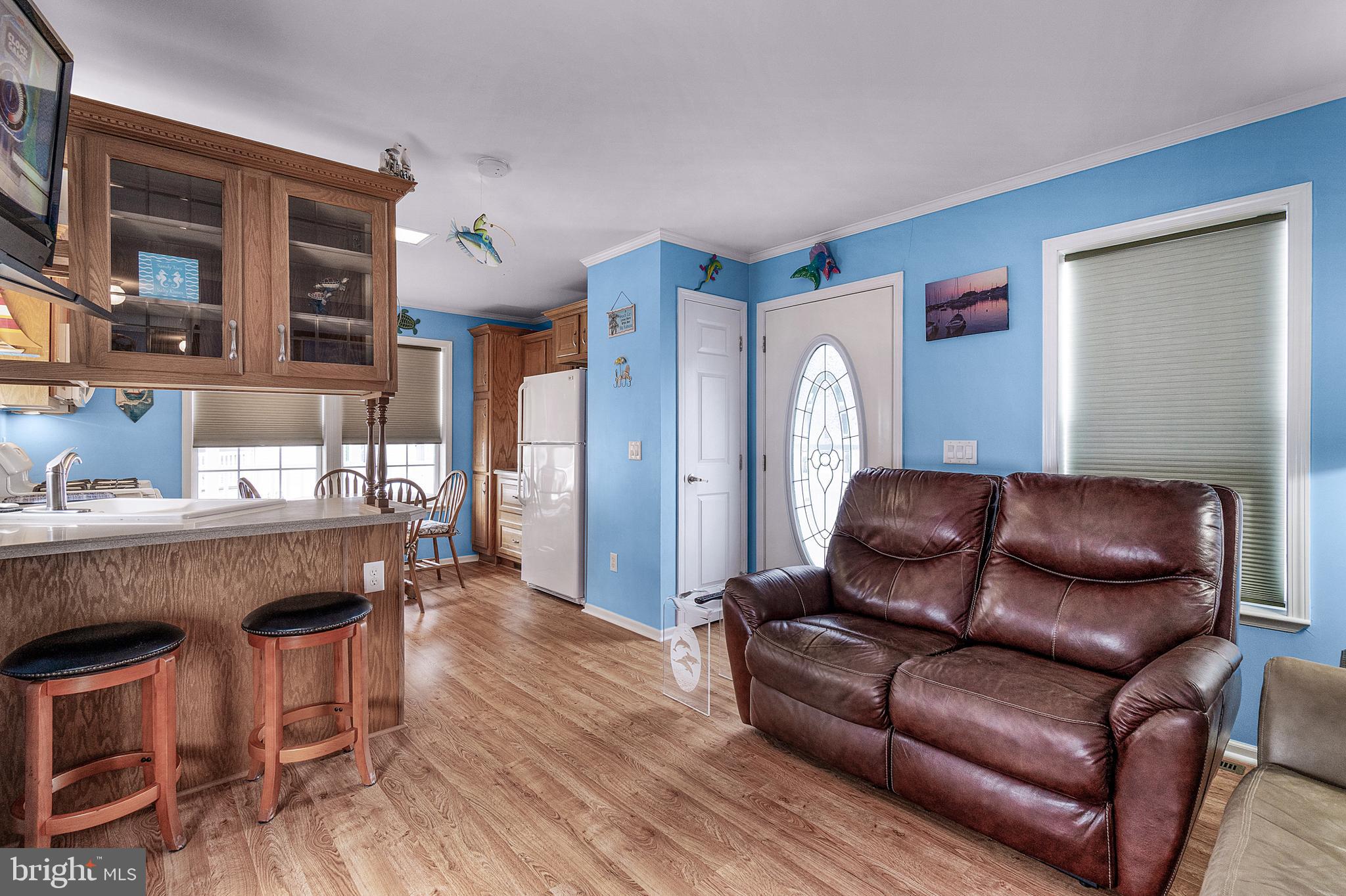1402 South Rte 9, Unit 25 Cape May Court House, NJ 08210 - Photo 12 of 32 a living room with furniture and a wooden floor