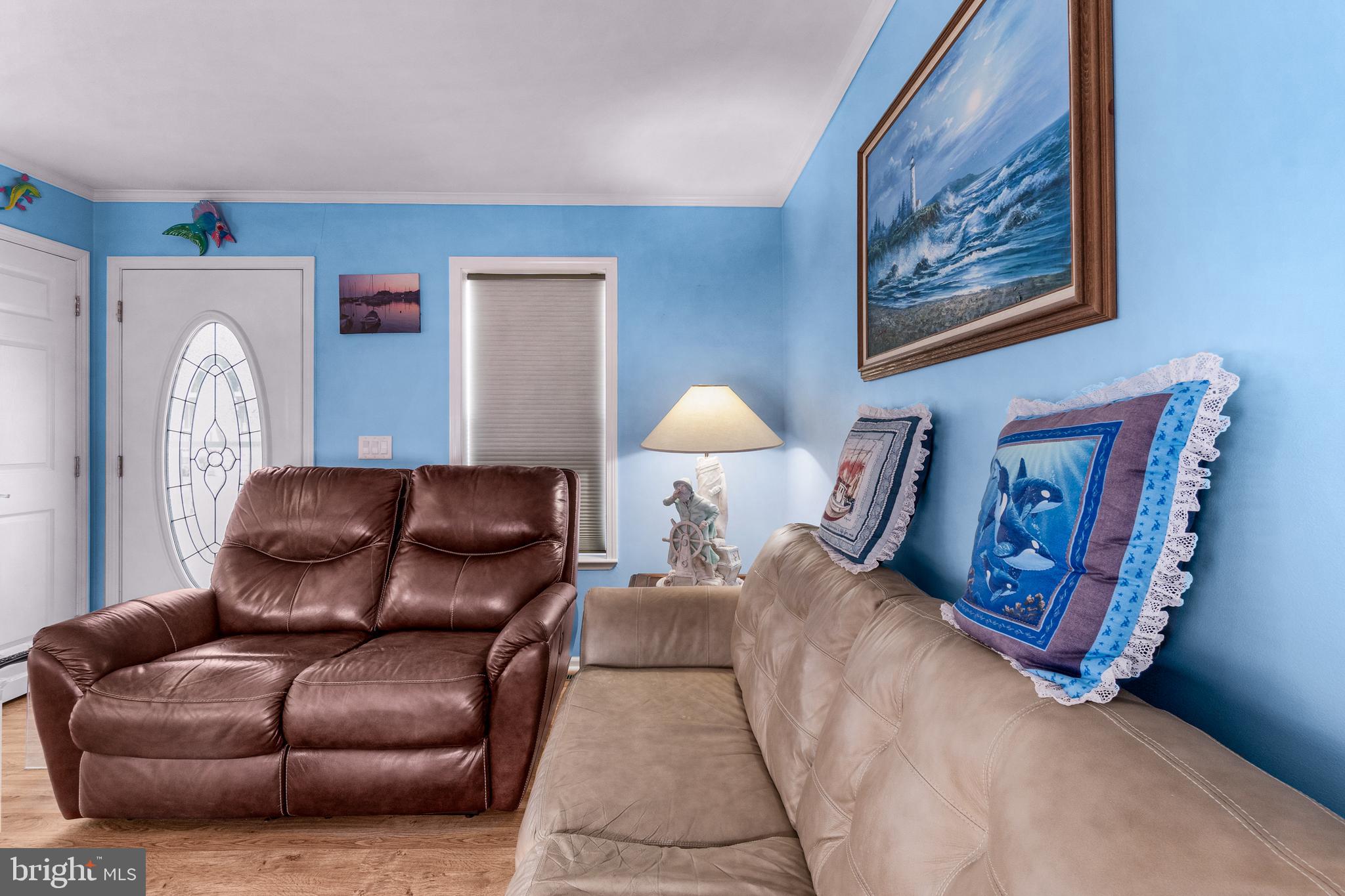 1402 South Rte 9, Unit 25 Cape May Court House, NJ 08210 - Photo 13 of 32 a living room with furniture and a lamp