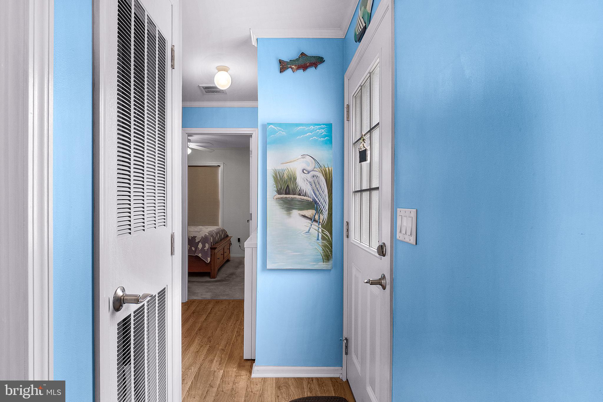 1402 South Rte 9, Unit 25 Cape May Court House, NJ 08210 - Photo 15 of 32 a view of a hallway with wooden floor and livingroom