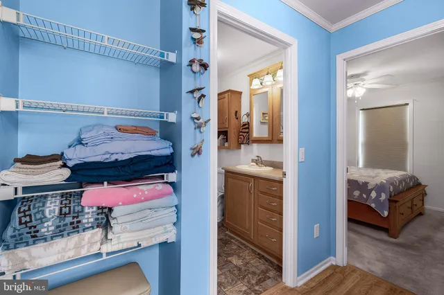 a view of bedroom with a bed and furniture