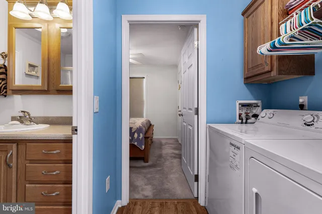 a view of bathroom with a sink and a mirror