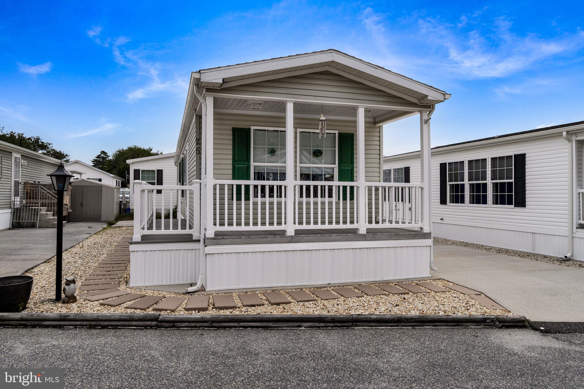 1402 South Rte 9, Unit 25 Cape May Court House, NJ 08210 - Photo 2 of 32 a front view of a house with a yard