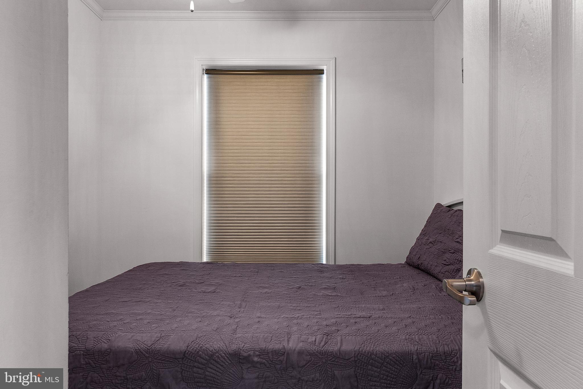 1402 South Rte 9, Unit 25 Cape May Court House, NJ 08210 - Photo 27 of 32 a bedroom with a bed