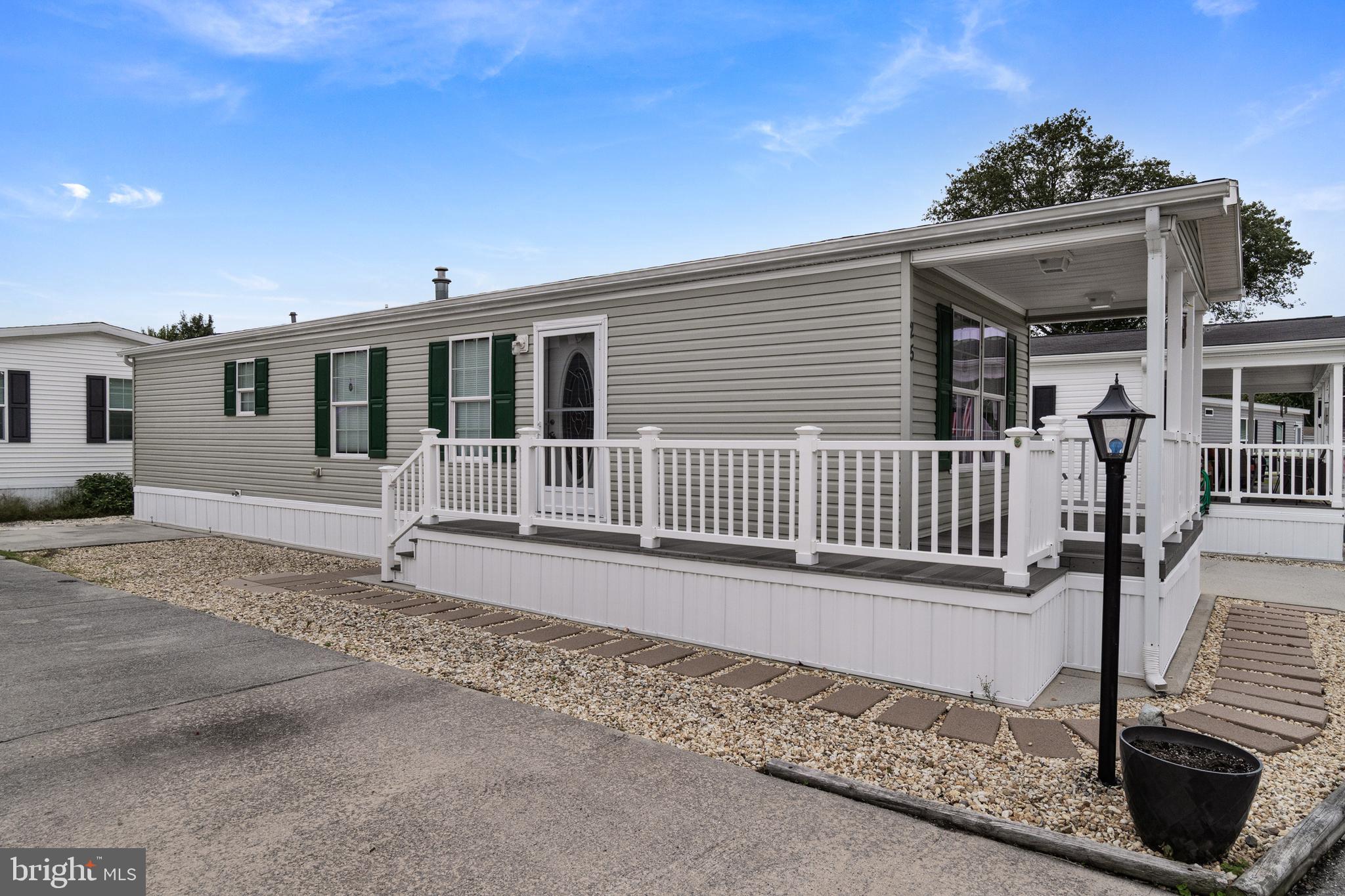 1402 South Rte 9, Unit 25 Cape May Court House, NJ 08210 - Photo 4 of 32 a front view of a house with a porch
