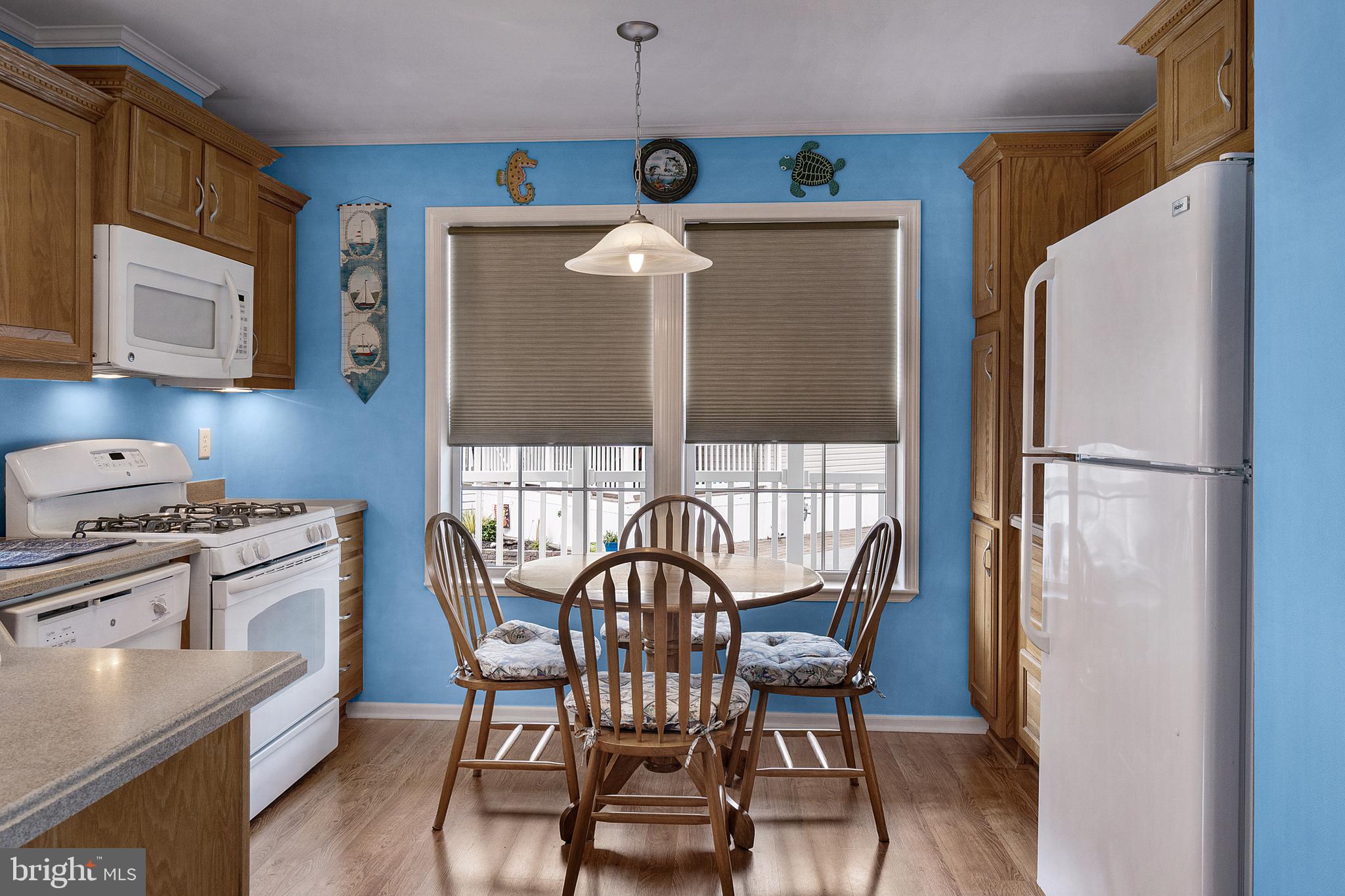 1402 South Rte 9, Unit 25 Cape May Court House, NJ 08210 - Photo 5 of 32 a view of a dining room with furniture window and wooden floor