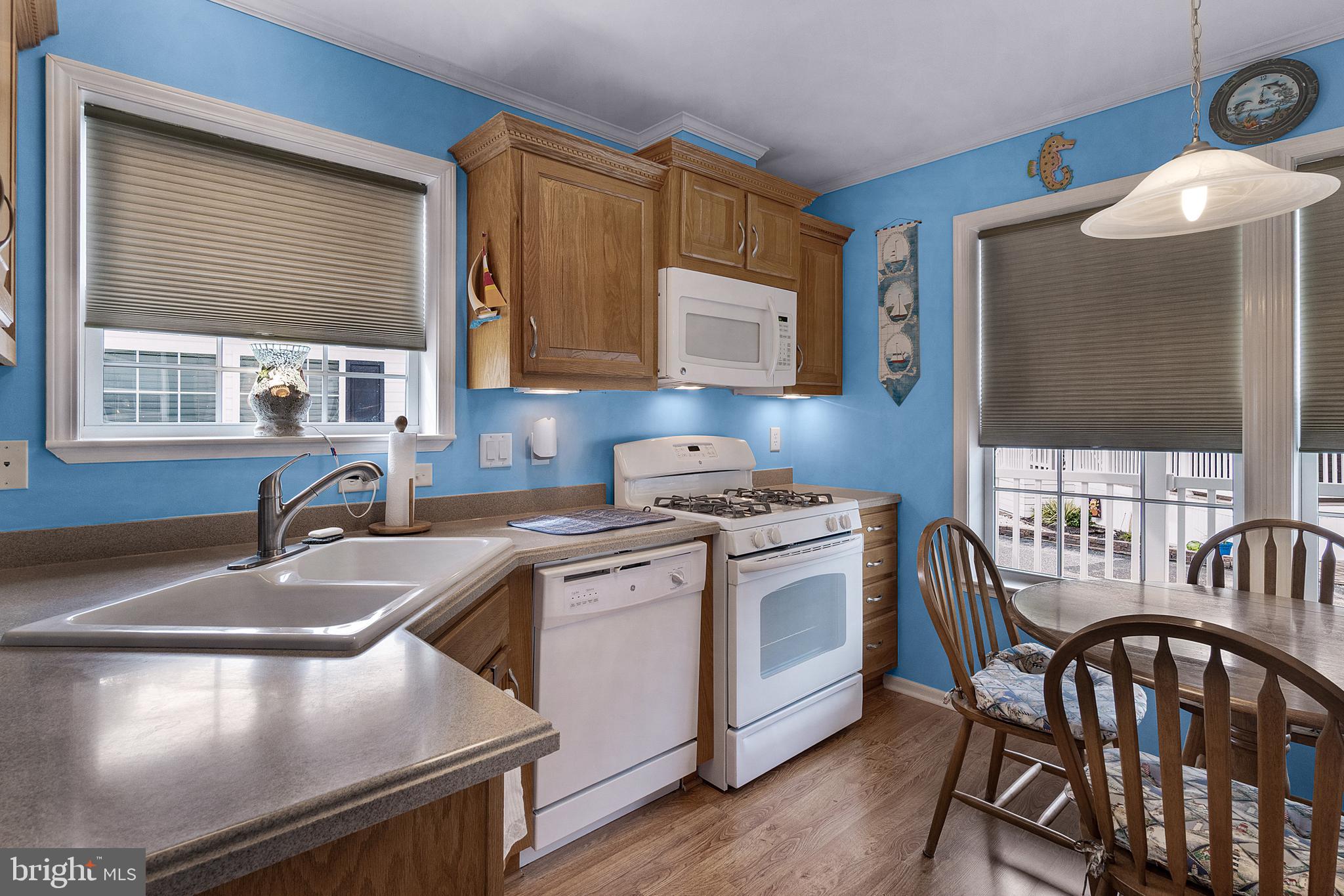1402 South Rte 9, Unit 25 Cape May Court House, NJ 08210 - Photo 6 of 32 a kitchen that has a sink and a stove