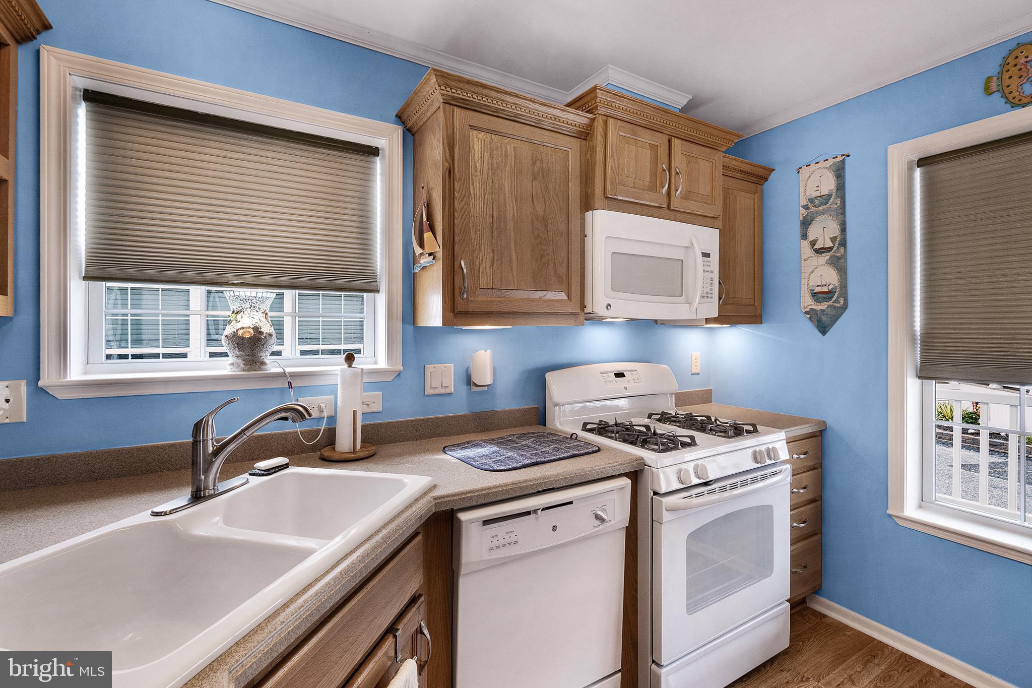 1402 South Rte 9, Unit 25 Cape May Court House, NJ 08210 - Photo 7 of 32 a kitchen with granite countertop a sink a stove and cabinets