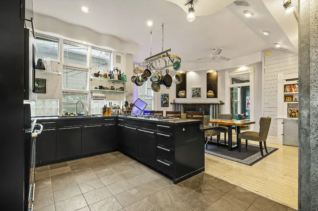 a kitchen with stainless steel appliances granite countertop a sink and cabinets