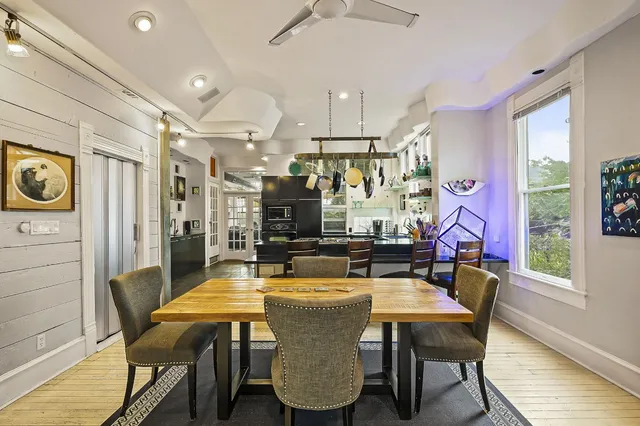 a dining room with furniture and window