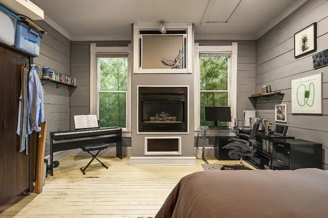 a living room with furniture fireplace and flat screen tv