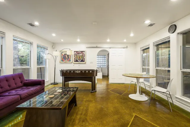 a living room with furniture and a table