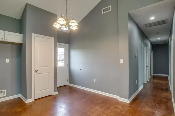 a view of a livingroom with a ceiling fan and window