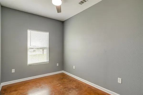 a kitchen with cabinets and window