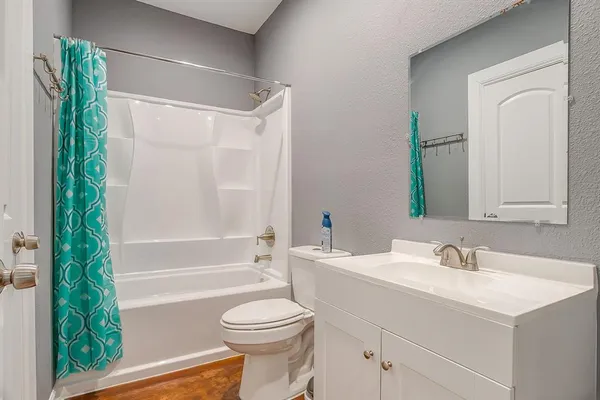 an empty room with wooden floor