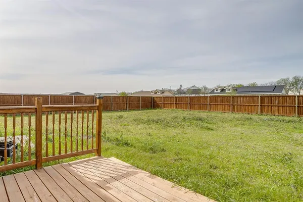 a view of a terrace with yard