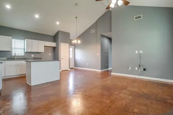 a view of a kitchen with a sink and a window