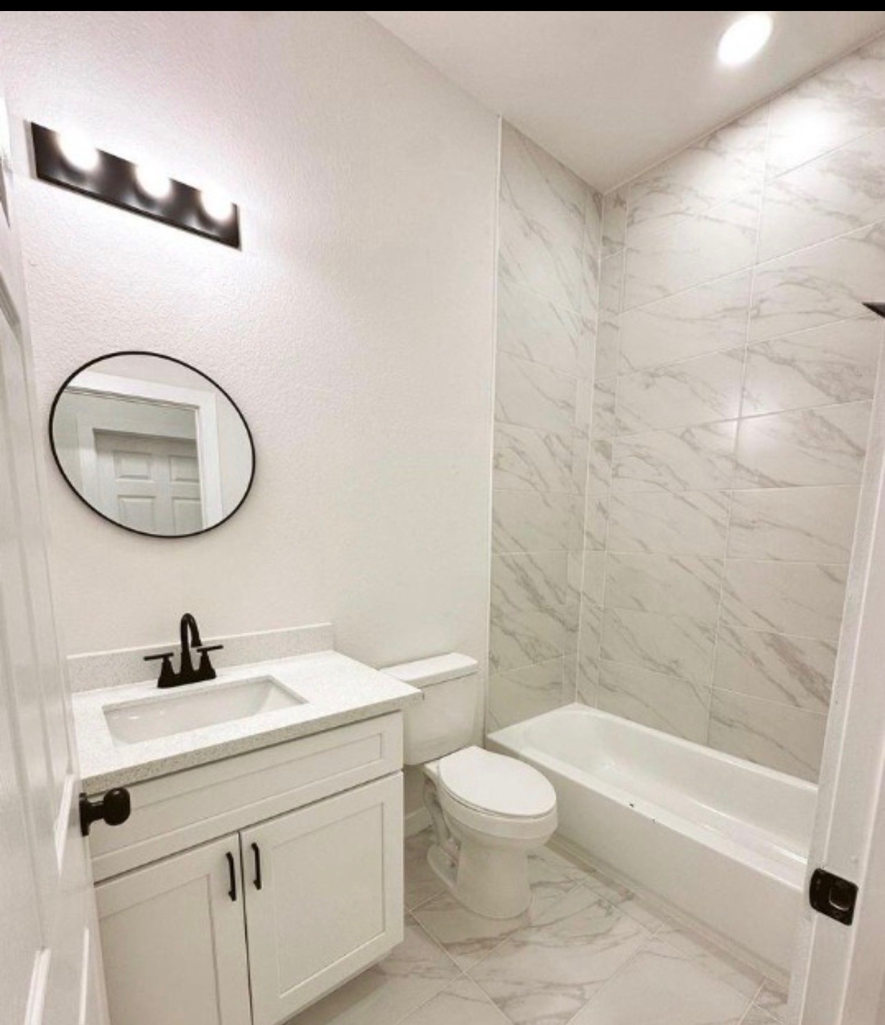9705 Garcroft Street, Unit A Houston, TX 77029 - Photo 8 of 12 a bathroom with a sink a toilet and a mirror