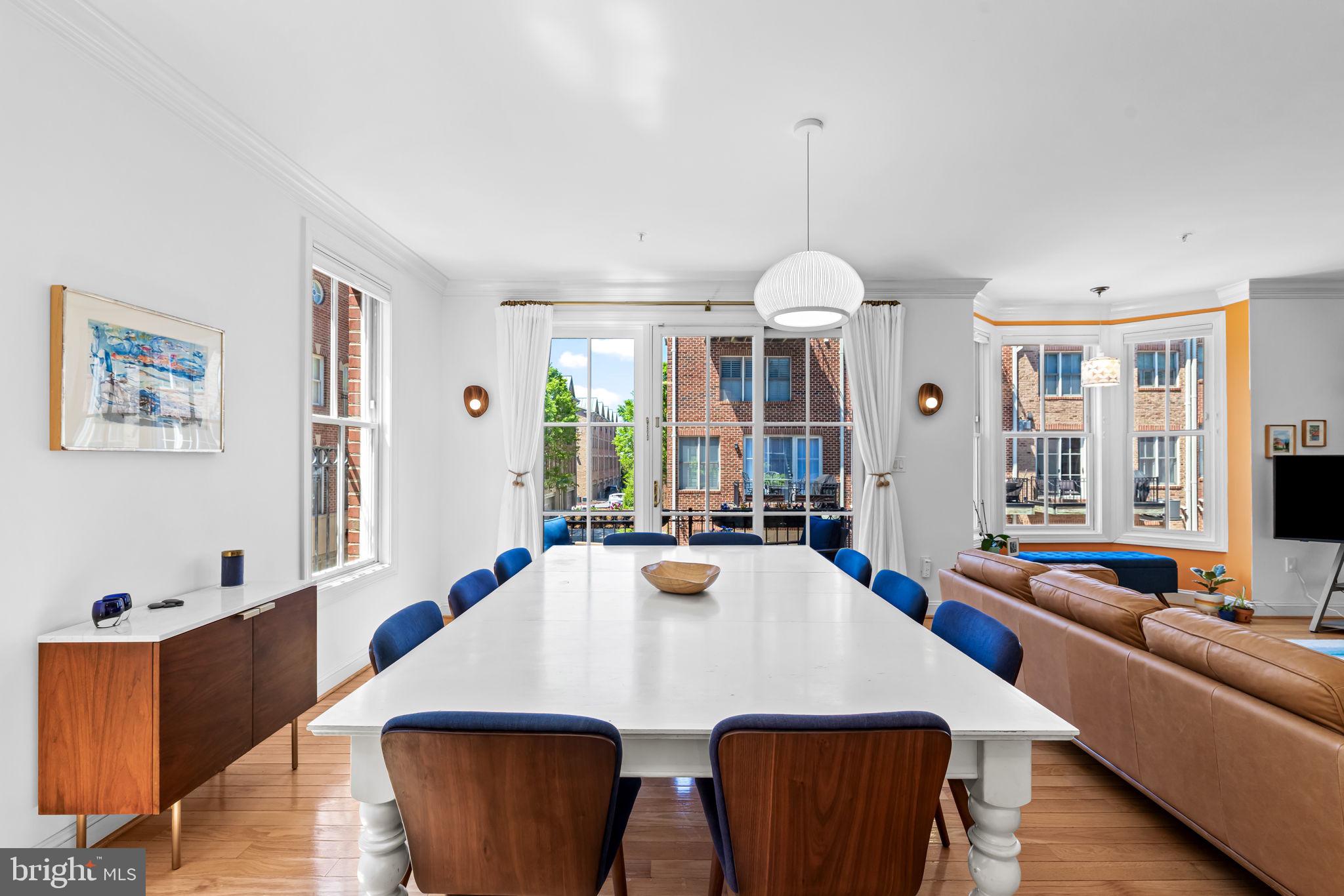 2331 Boston Street, Unit 1 Baltimore, MD 21224 - Photo 21 of 74 a view of a dining room with furniture and a chandelier