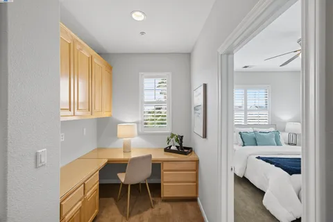 a bedroom with a bed dresser and a window