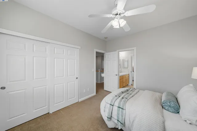 a bathroom with a granite countertop sink mirror and bathtub