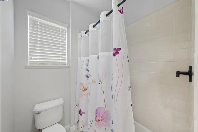 swimming pool view with a seating space